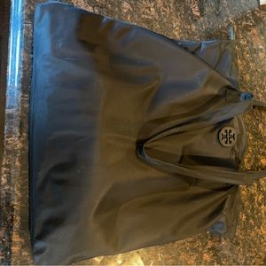 All black Tory Burch vinyl bag with god zipper detail